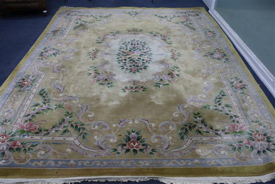 A yellow ground large rug 368cm x 275cm